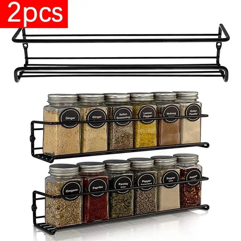 2 pack hanging spice rack in black metal holding spice jars on a kitchen wall